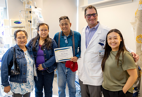 Doctor with patient and family