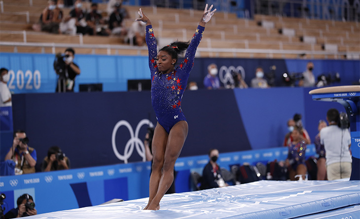 Olympic gymnast Simone Biles landing after a vault routine during Tokyo 2020 Olympic Games.