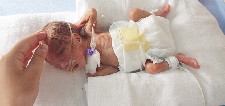 Small baby in NICU incubator