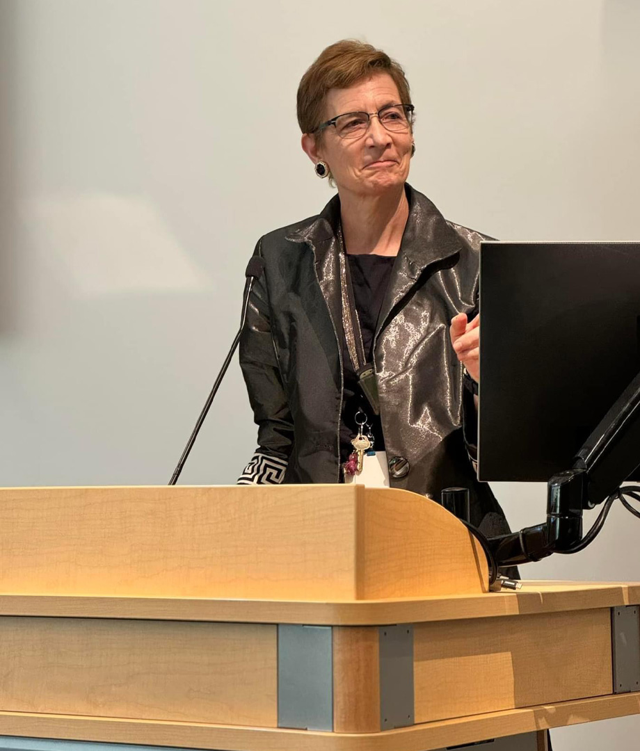 Dr. Tina Palmieri stands at podium