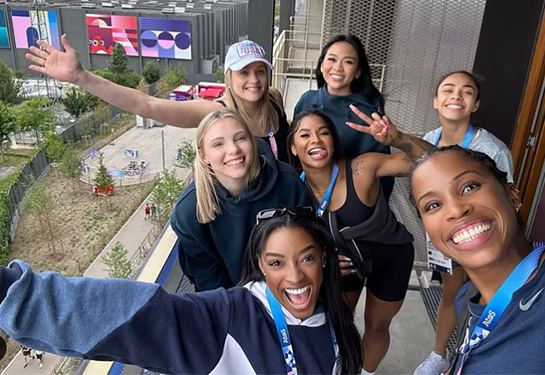 Dr. Faustin taking a selfie of the gymnastics team