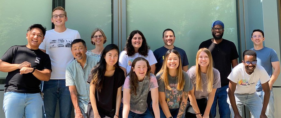 A group of 13 members of LaSalle Lab smiling to the camera