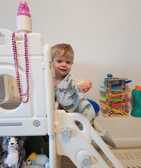 Tobi on play equipment