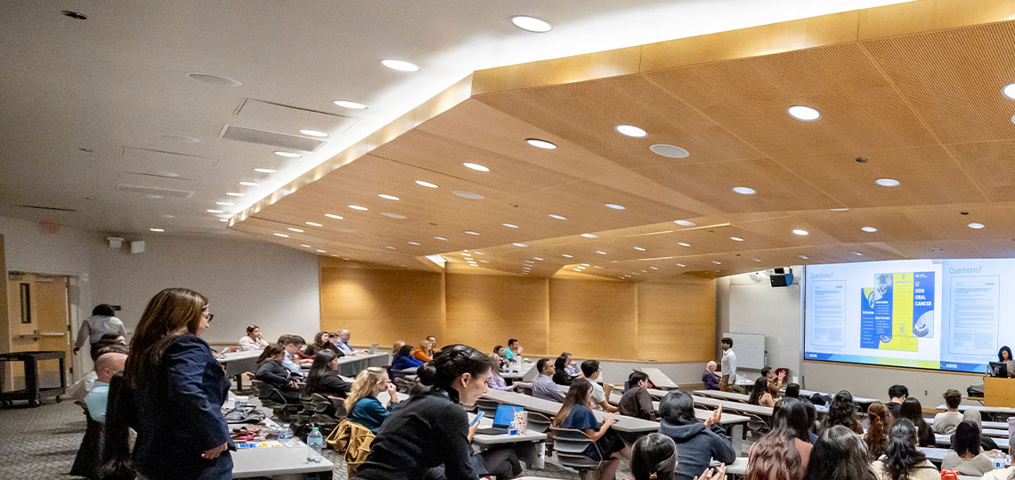 Large audience in an auditorium.