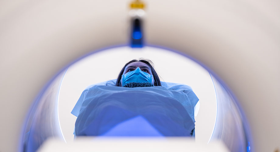 woman lying on back in medical scanner