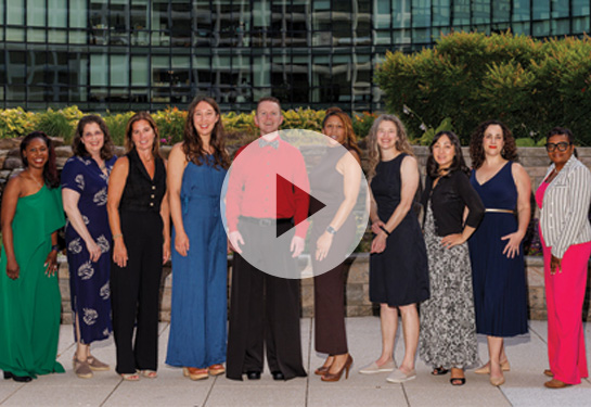 Group of fellows stand next to each other posing for camera