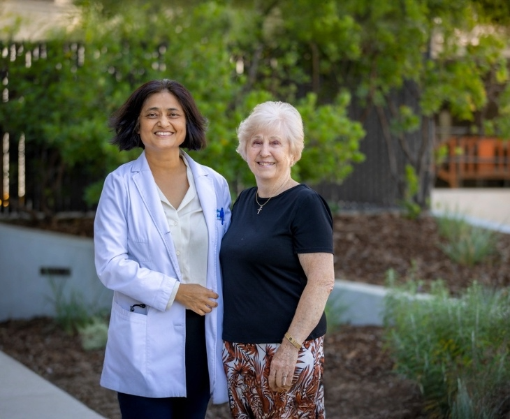 Surabhi Atreja and Else Carr standing arm-in-arm.
