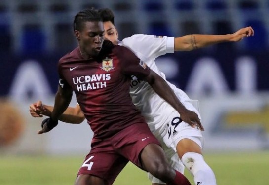 soccer player wearing uc davis health branded jersey