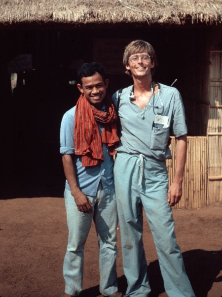 Garen Wintemute and a colleague stand next to each other outside a makeshift hospital in Cambodia.