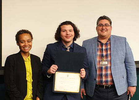 Group of three people, two men and one woman.