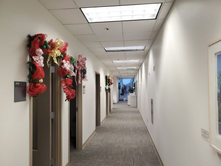 Hallway with streams of red and green ribbon down the aisle