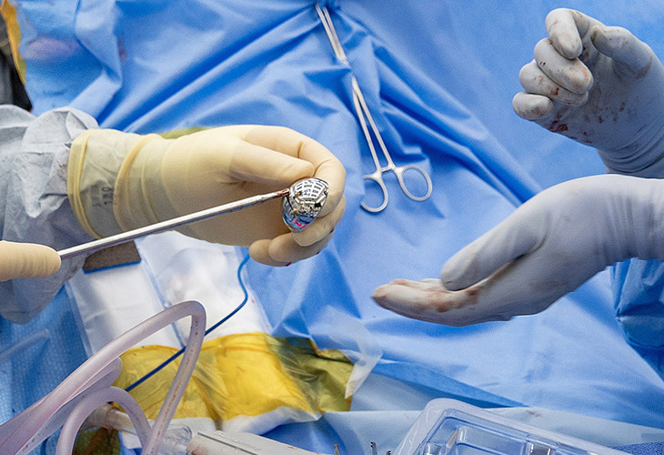 Surgeon Mariano Menendez and the surgical team prepare the implements during Mora's shoulder replacement.&nbsp;