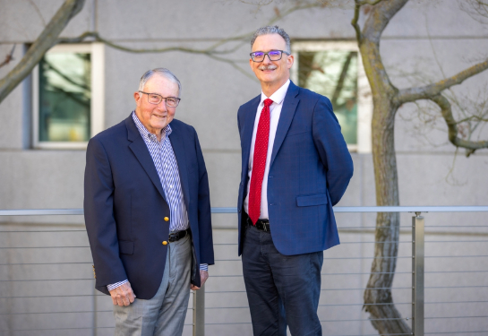 Two men standing together.