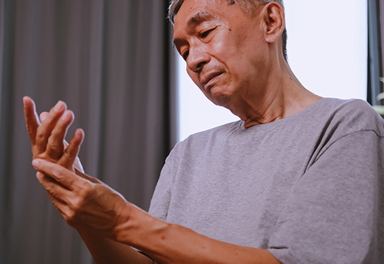 Asian man with hand tingling and numbness.