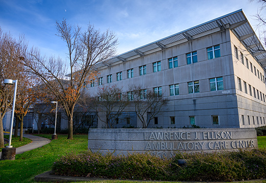 Large clinical building with sign that reads 'Lawrence J. Ellison Ambulatory Care Center'