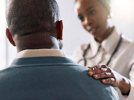 female provider discussing epilepsy and seizure symptoms with a patient