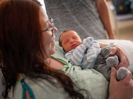 A mother holding her newborn baby
