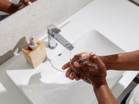 A person washing their hands with soap