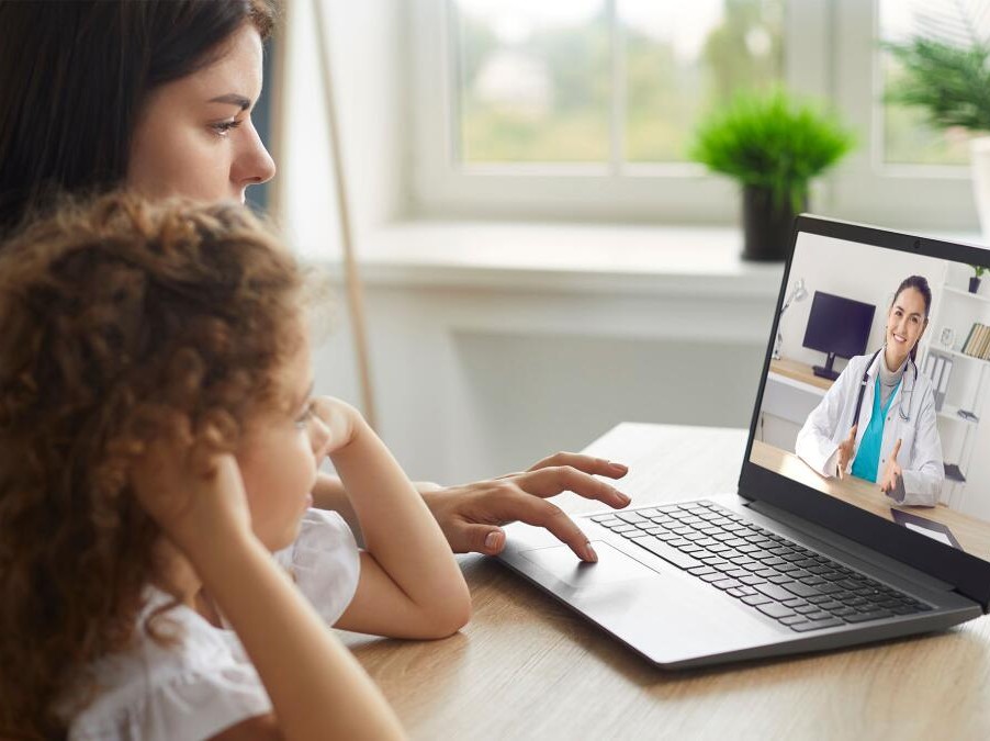 mom and daughter on virtual doctor visit