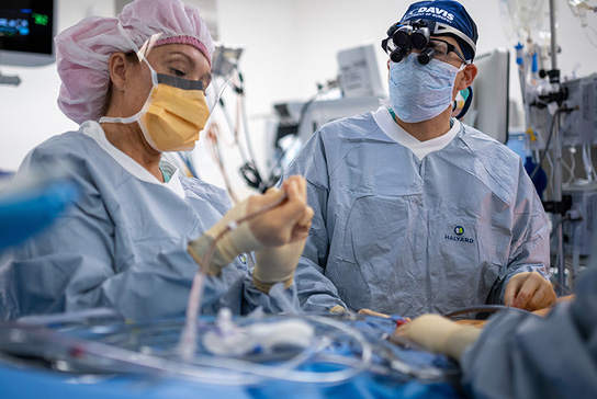 Surgeons working on a patient.