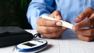 Man checking blood sugar levels