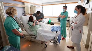 Hospital staff with obstetrics patient.