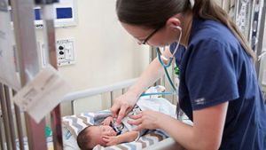 Nurse caring for infant