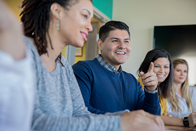 Group of diverse students seated at a table