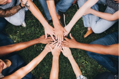 Circle made from a diverse group of peoples' arms