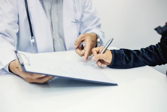 patient signing consent form