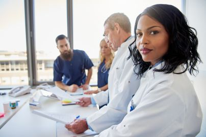 a group of medical professionals sitting at a table