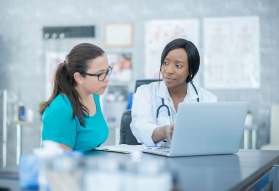 two people working in a medical office