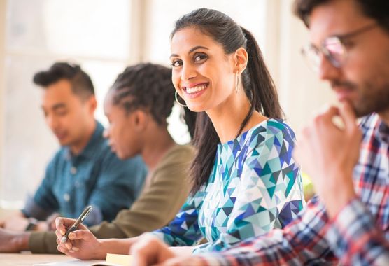 people working in a classroom