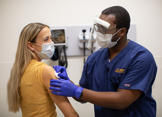 A patient getting vaccinated