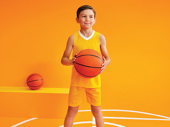Pediatric patient holding a basketball