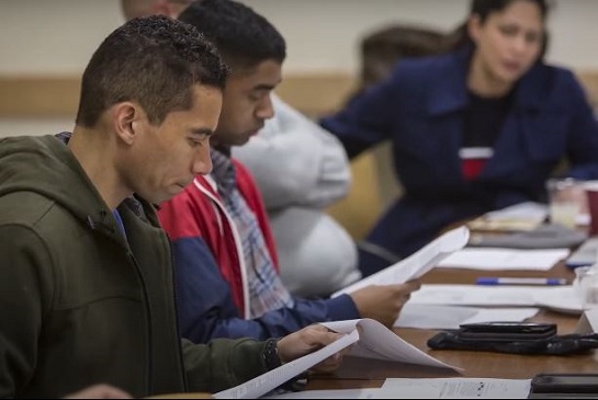 police accountability board members reading during a meeting