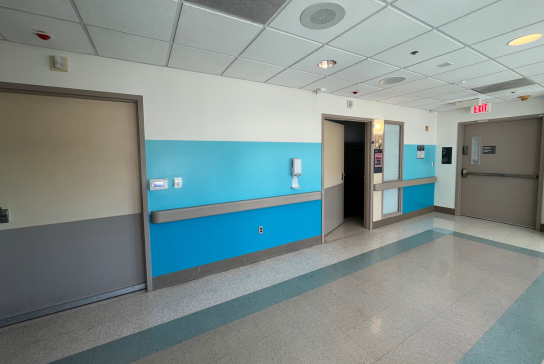 Photo of bright blue painted wall of Davis Tower Level 7