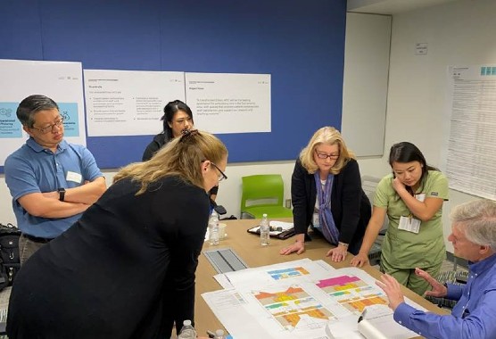 uc staff and consultants meet to discuss campus planning