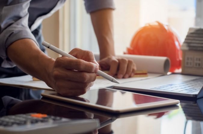 person writing on a tablet with a stylus