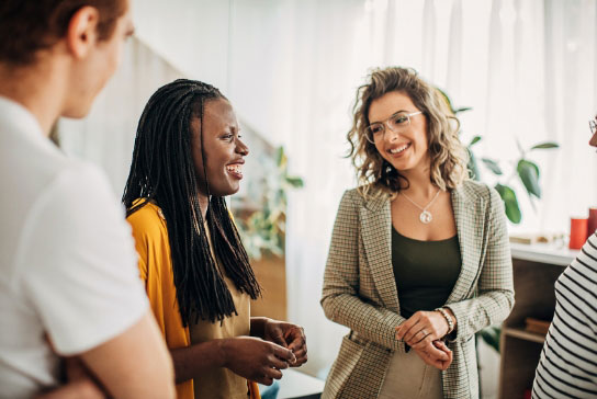women having a conversation in an office setting