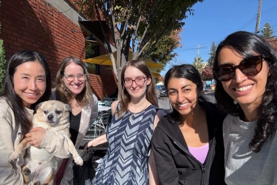 Group of faculty outside of a restaurant gathered for a WIMHS departmental morale event