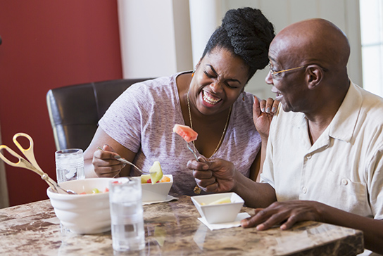 Woman with father at table