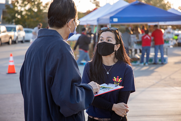 Oanh Meyer, right, talking with another person.