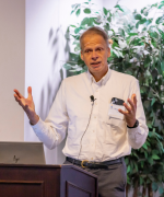 Christopher Koller speaking behind a podium.