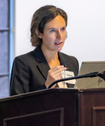 Ilana Yurkiewicz speaking behind a podium.