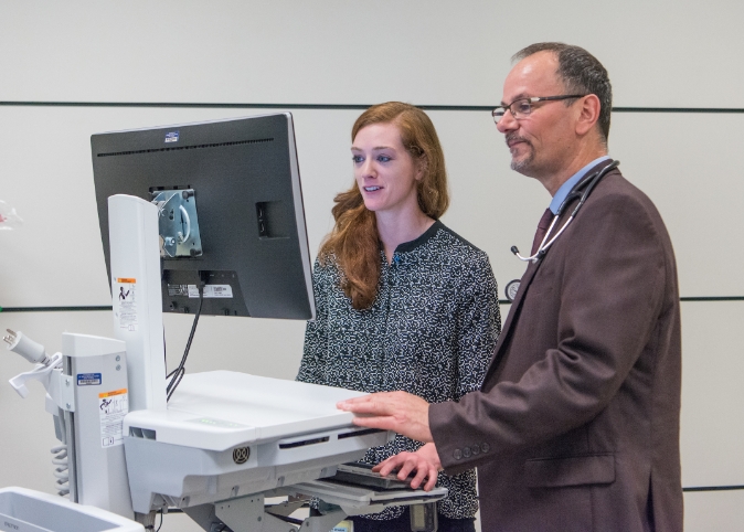 doctor and patient discussing a chart