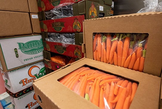 Boxes stacked with fresh produce.