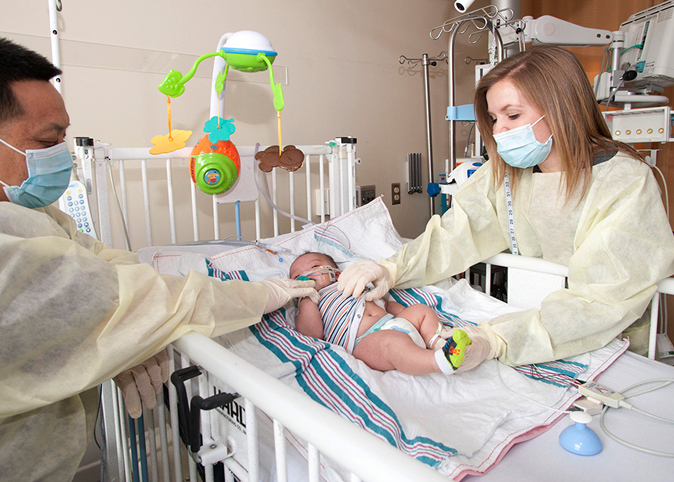 A medical patient eating a prepared meal in their bed.