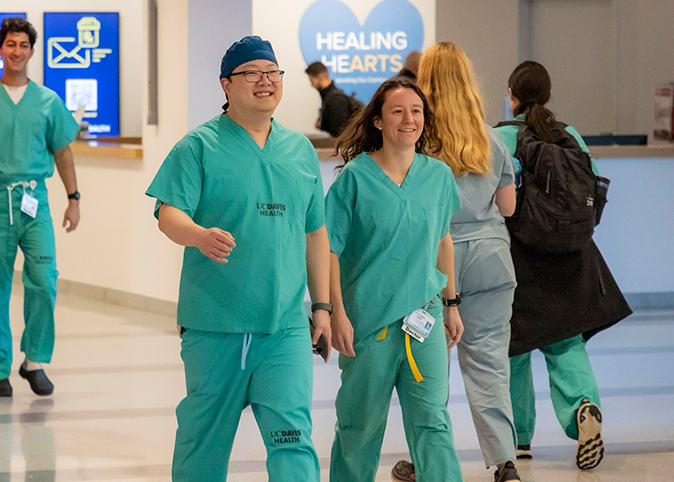Residents walking in a busy hallway.