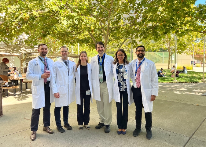 Pain Medicine residents outside, in front of trees.